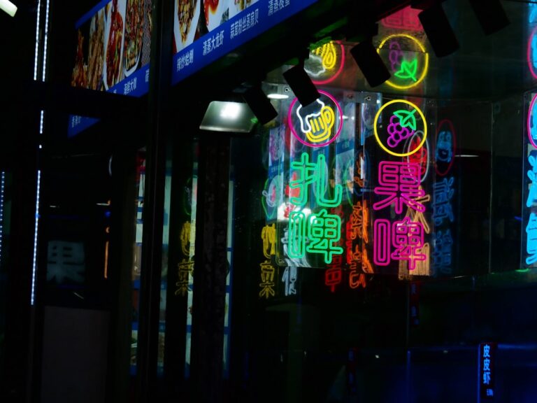 Classic 80s arcade machines glowing with neon lights