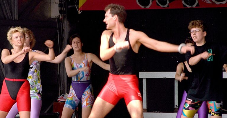 1980s aerobic exercise public demonstration showing workout fashion and fitness culture
