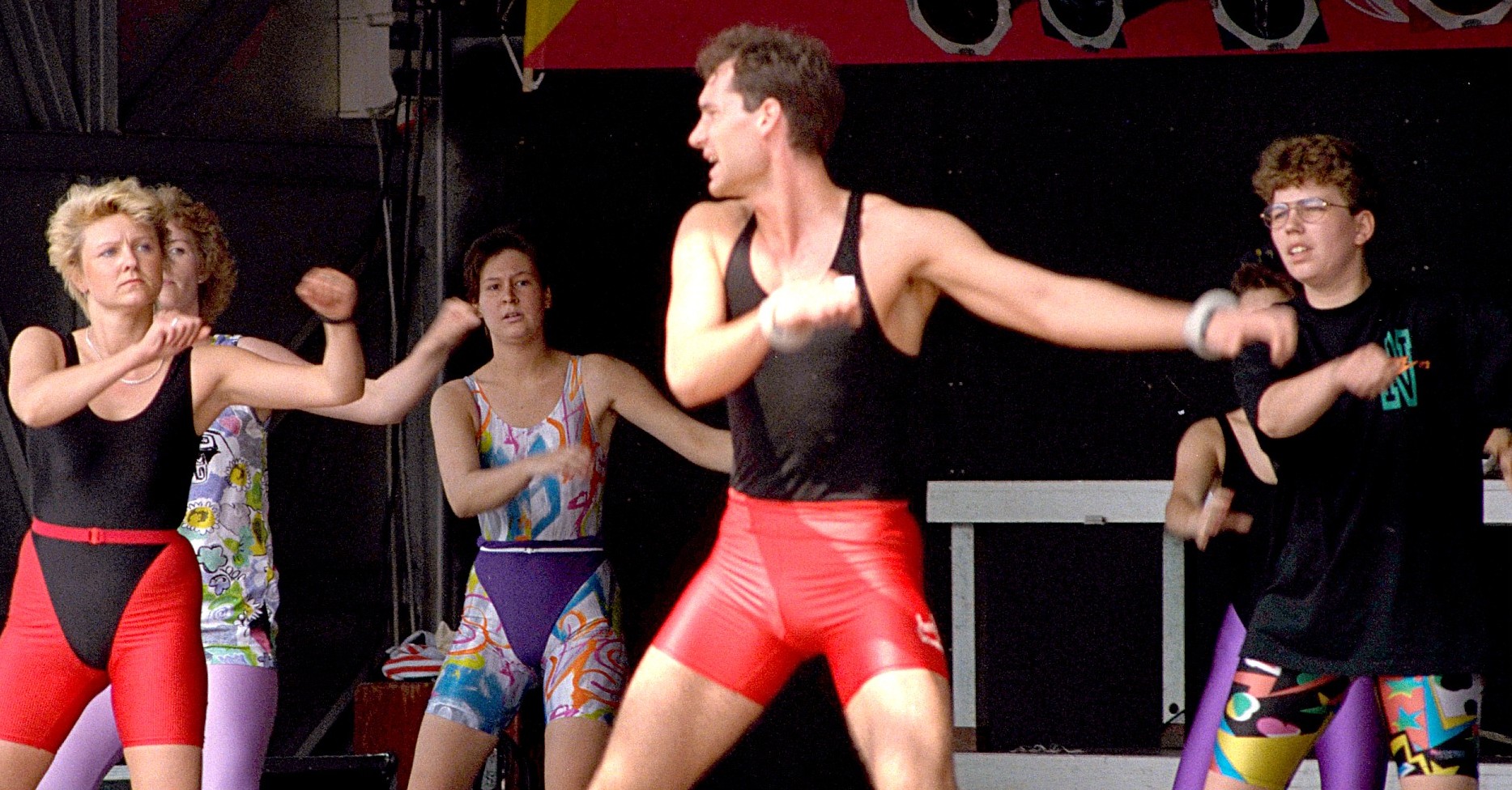 1980s aerobic exercise public demonstration showing workout fashion and fitness culture