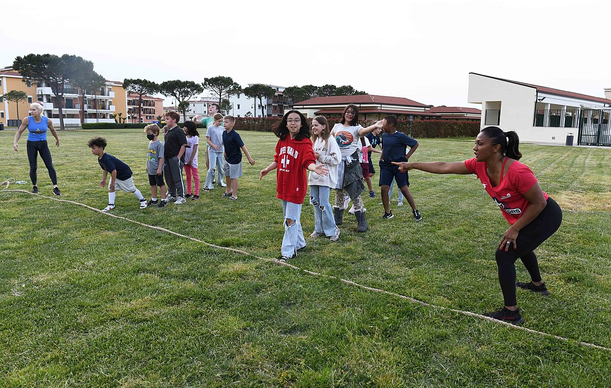 American Gladiators cast members at a live fan event showcasing 90s nostalgia