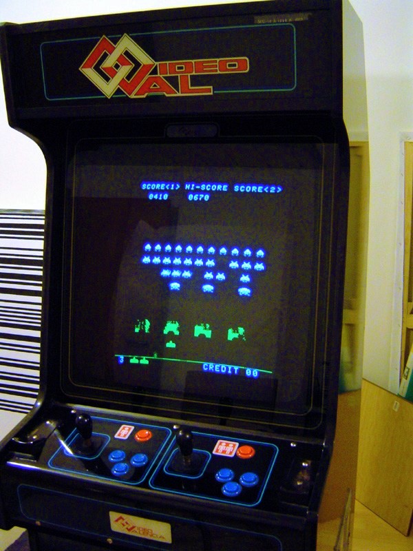 Space Invaders arcade cabinet with classic pixel art