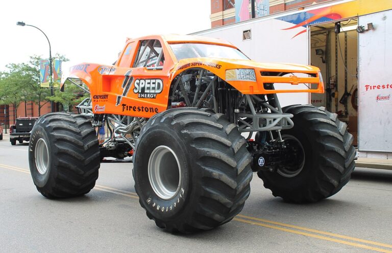 Bigfoot 19 monster truck at outdoor event showcasing massive tires and Ford body