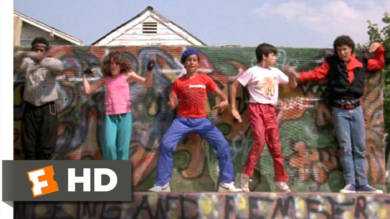Breakin 1984 movie crew in street clothes under a bridge in classic breakdancing movie scene