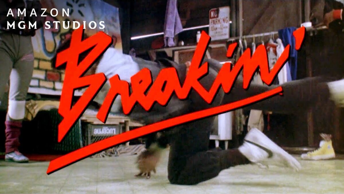 Breakin 1984 movie title card featuring the iconic red logo and breakdancers