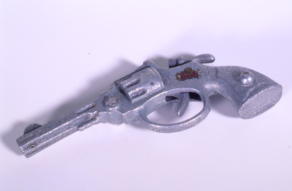 Vintage toy cap gun from museum collection resembling Western revolver