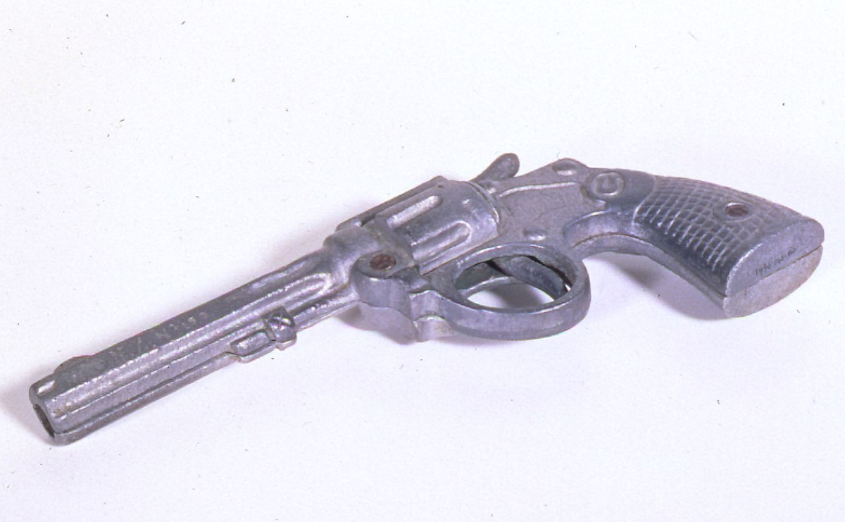 Classic toy cap gun collection piece showing Western-style revolver
