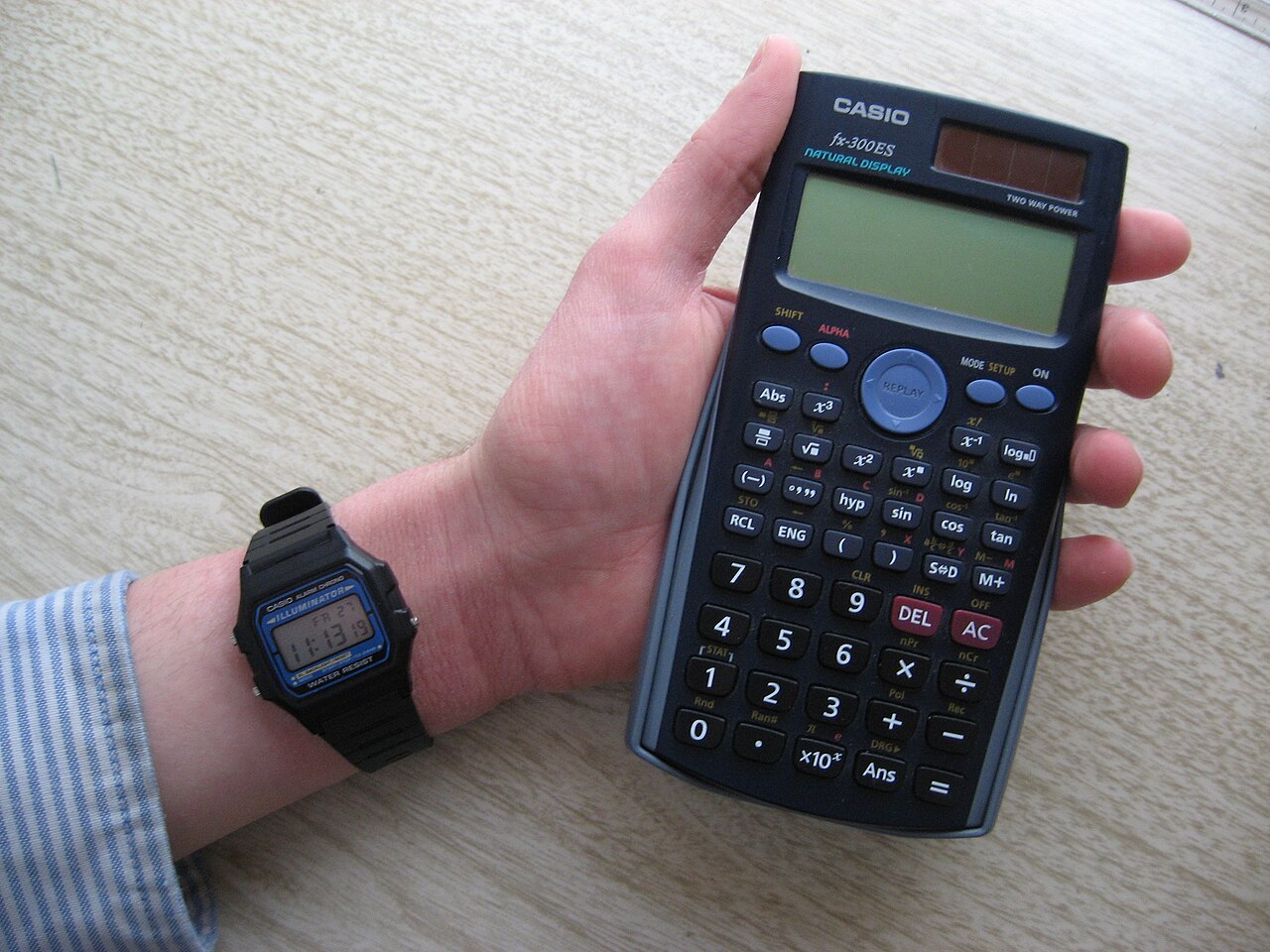 Casio F-105W digital watch alongside calculator comparison