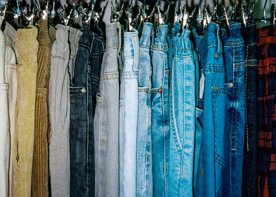 Racks of denim jeans showing the timeless appeal of 80s fashion trends