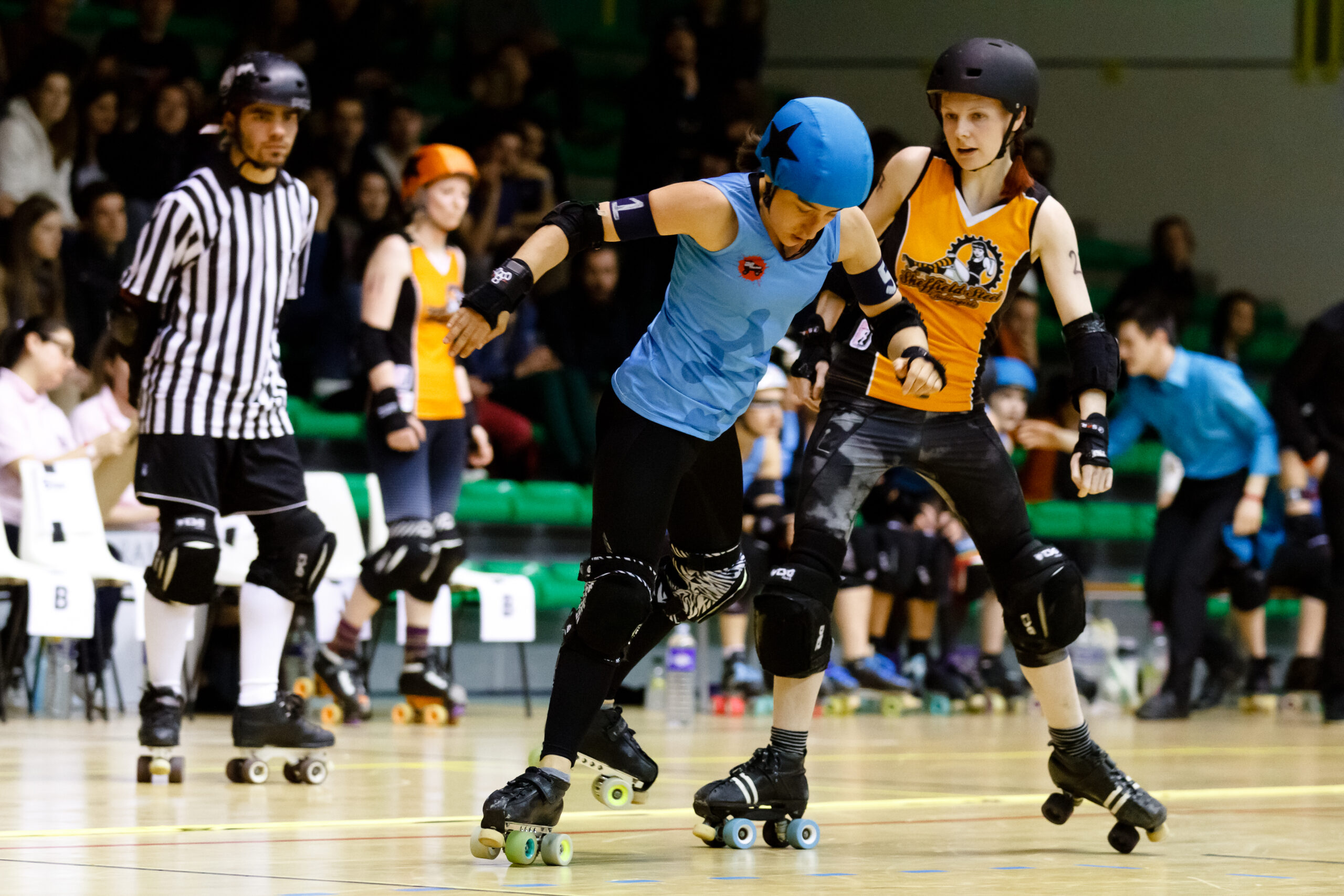 Roller derby jammer passing through the pack during competitive match