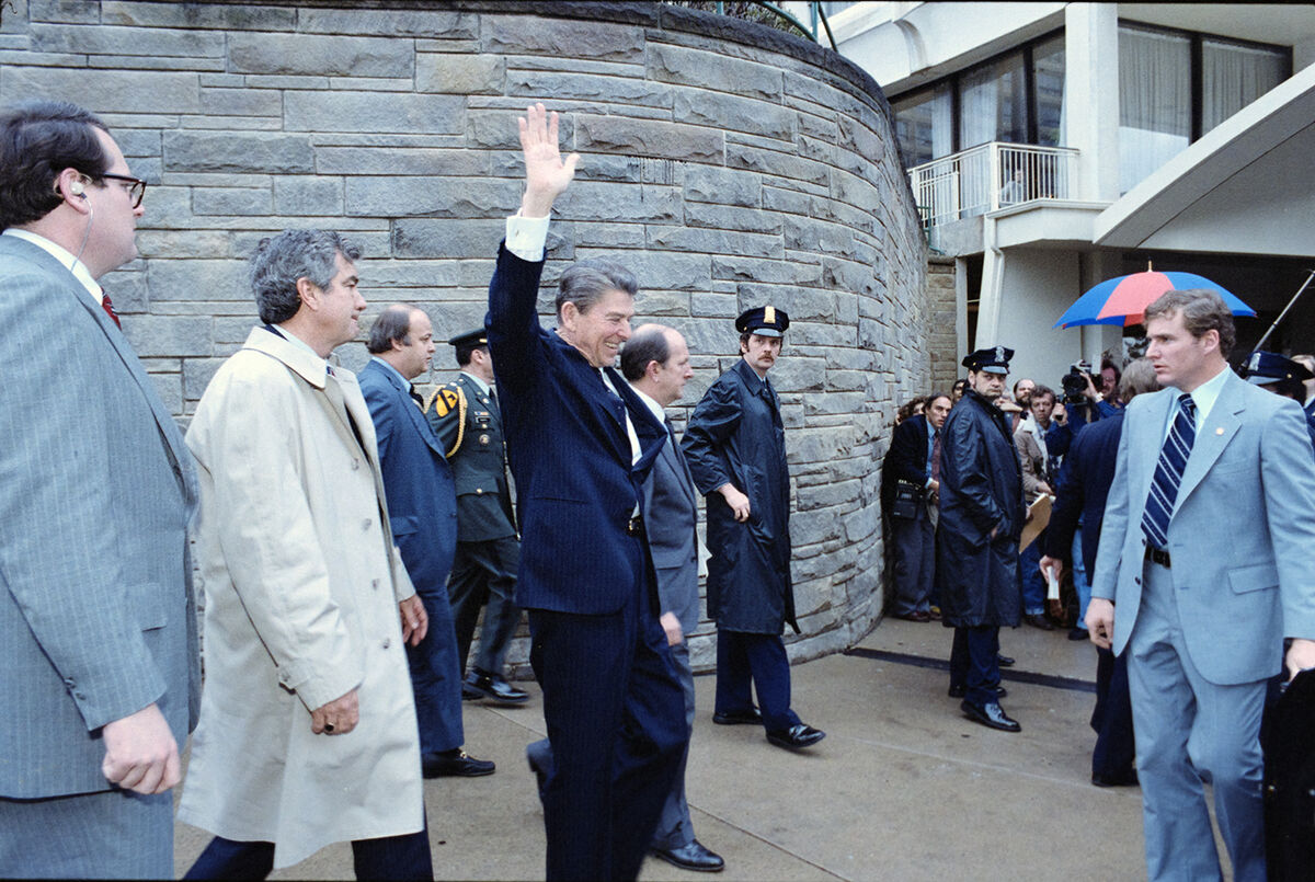 President Reagan waves to the crowd seconds before being shot outside the Washington Hilton Hotel on March 30, 1981