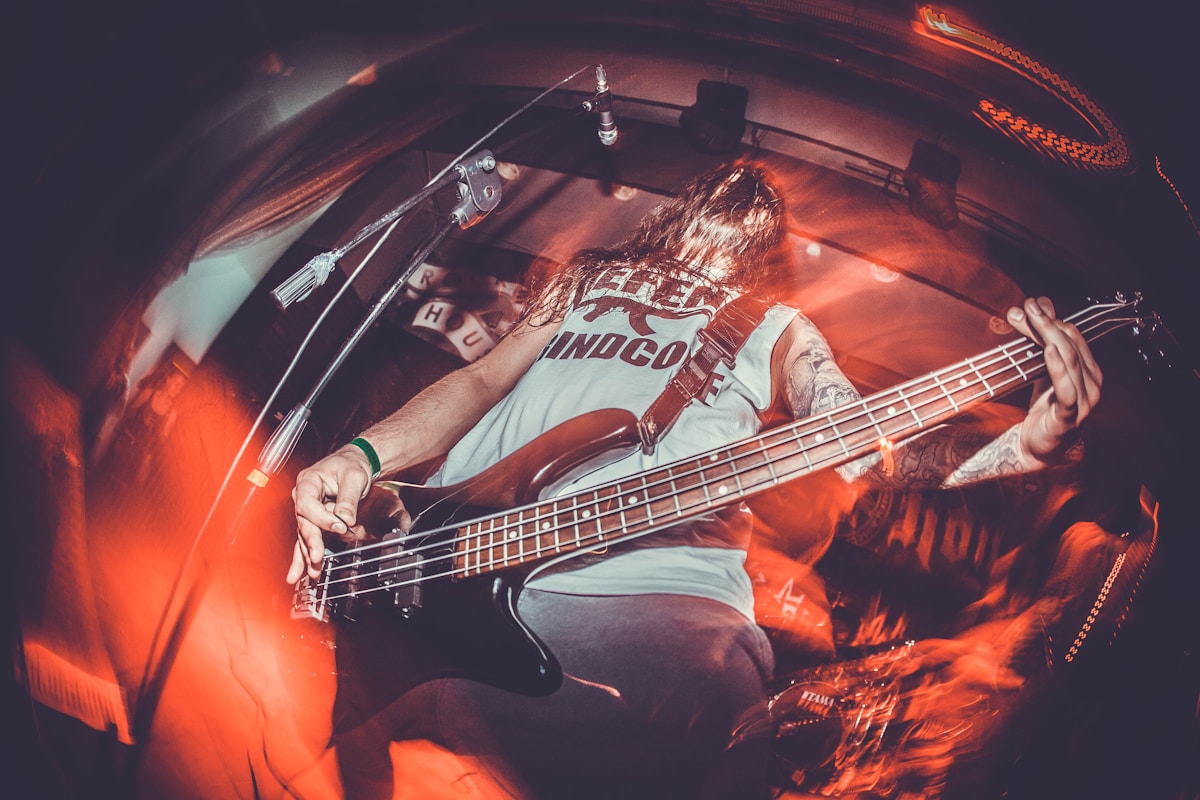Guitarist performing live at metal concert on stage