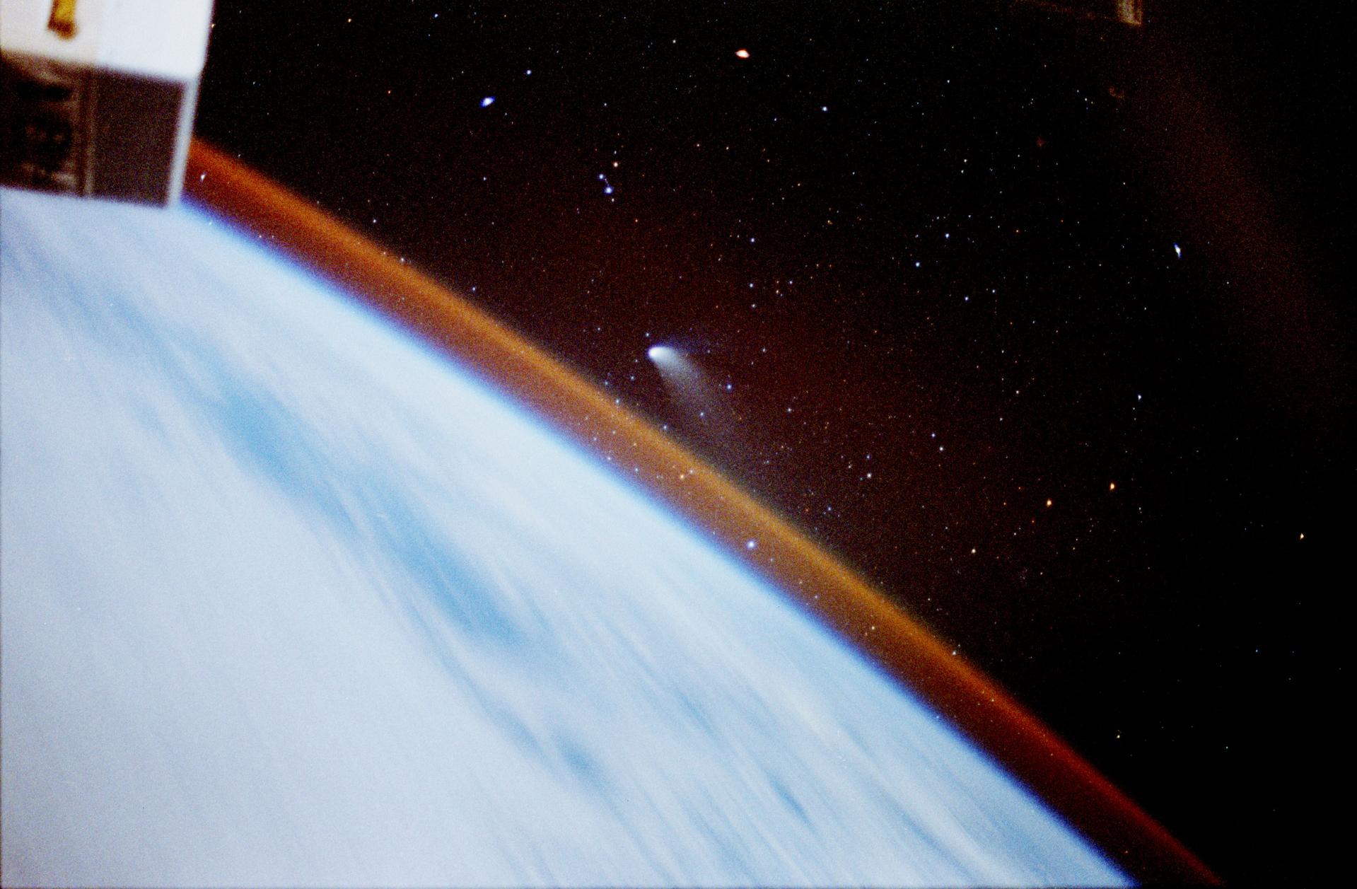 Hale-Bopp comet photographed from Earth orbit showing spectacular view above atmosphere during March 1997 when Heaven's Gate mass suicide occurred