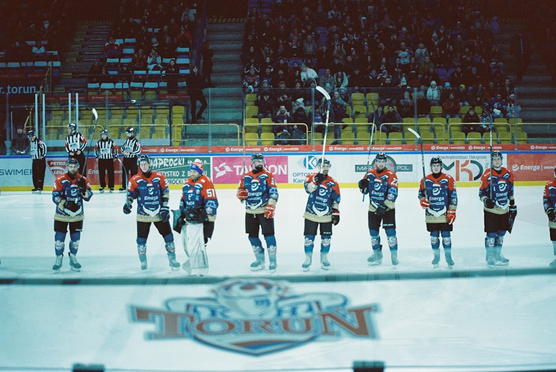 Ice hockey team celebrating on ice after championship victory
