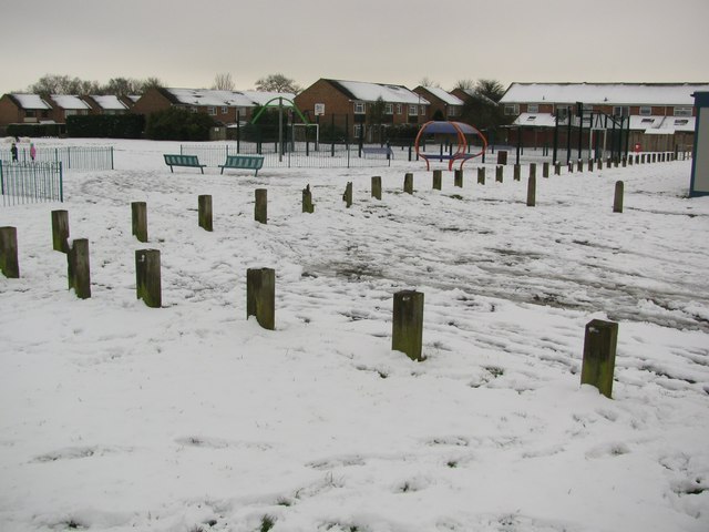 Neighborhood playground with swings and climbing frame for kids