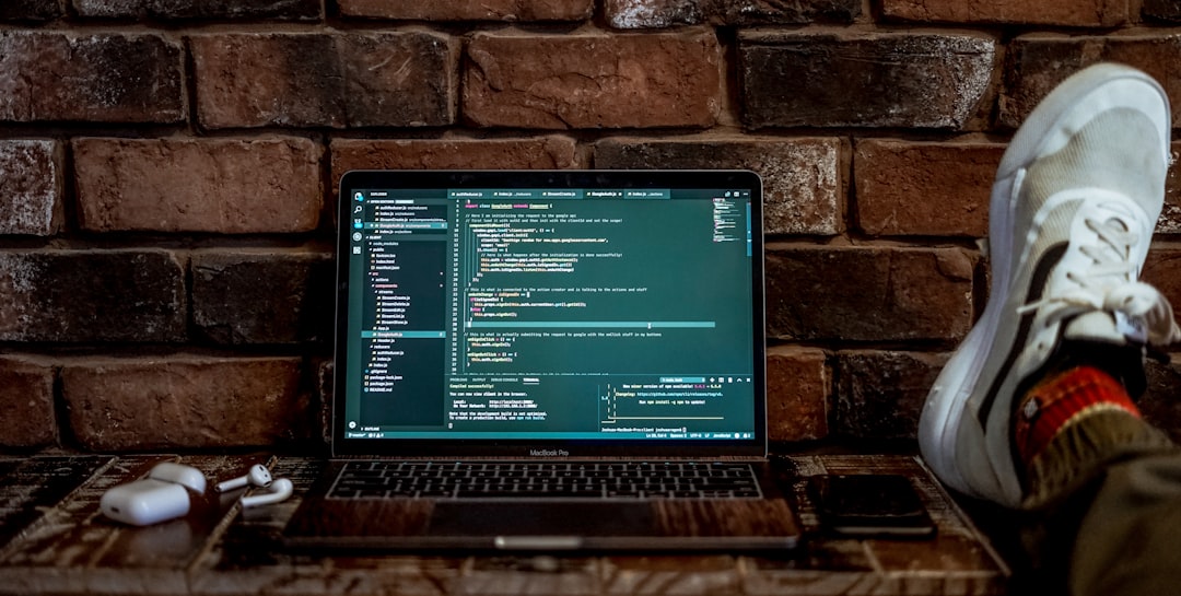 Programming laptop displaying code editor similar to tools developers used to contribute to the first wiki