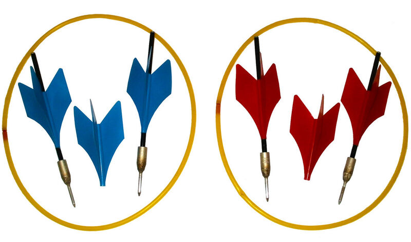 Lawn darts Jarts red and blue darts in yellow target rings showing banned 1980s backyard game setup