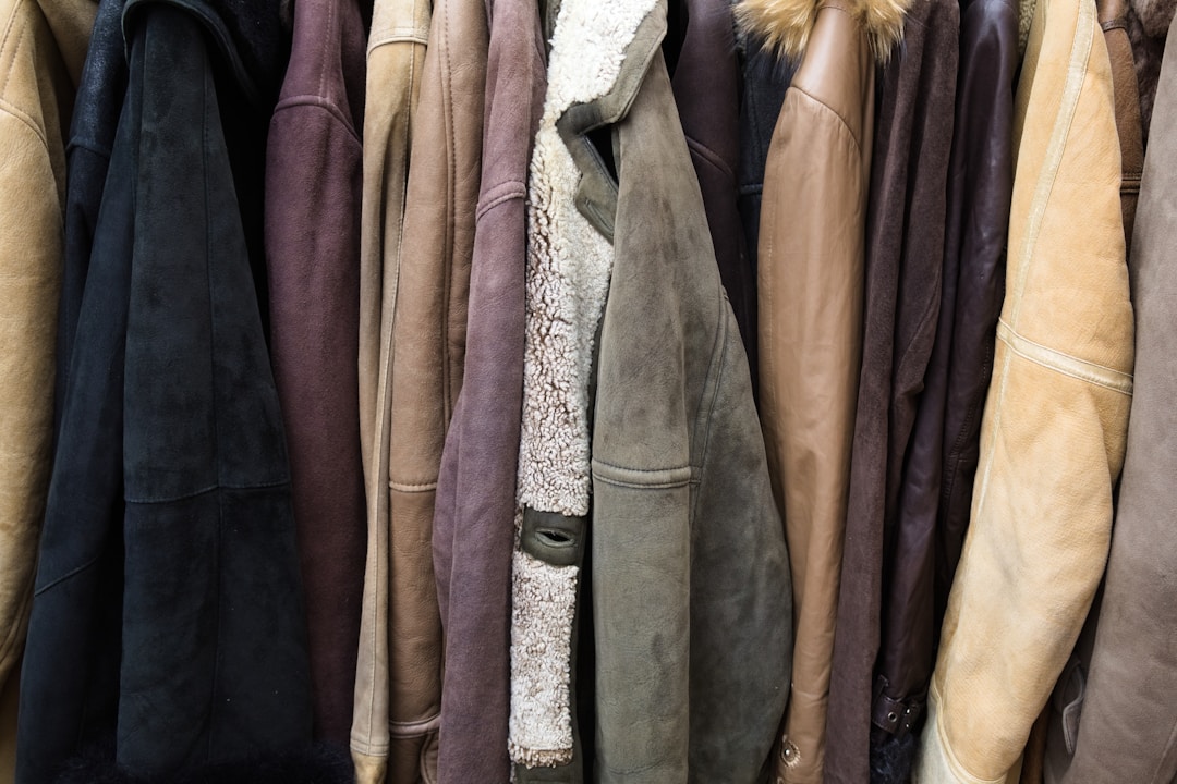 Collection of leather jackets hanging in vintage store grunge fashion