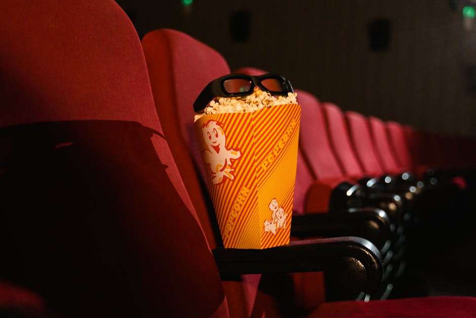 Movie theater seats with popcorn and viewing glasses ready for a film