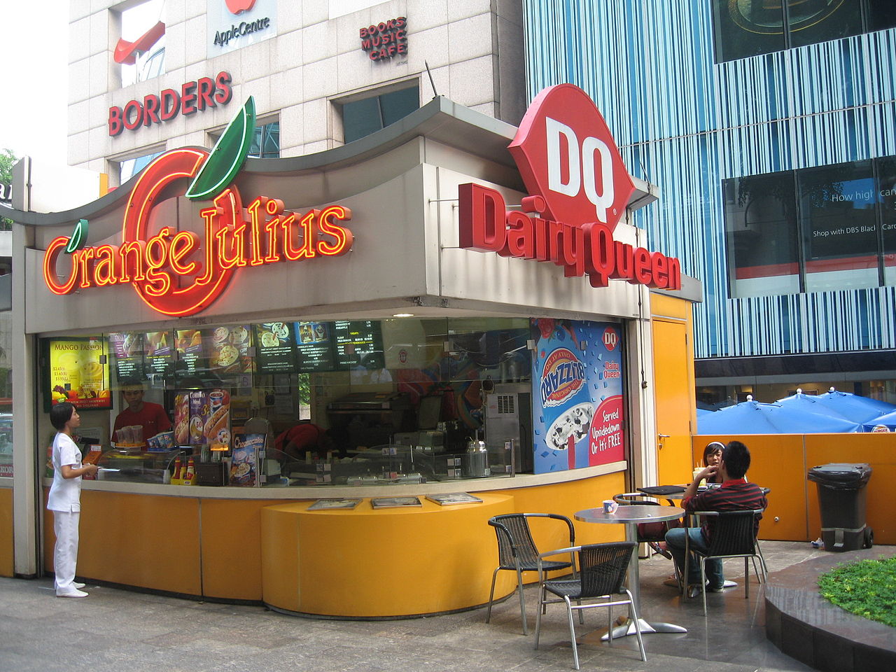 Orange Julius food stand in a shopping mall food court with menu visible