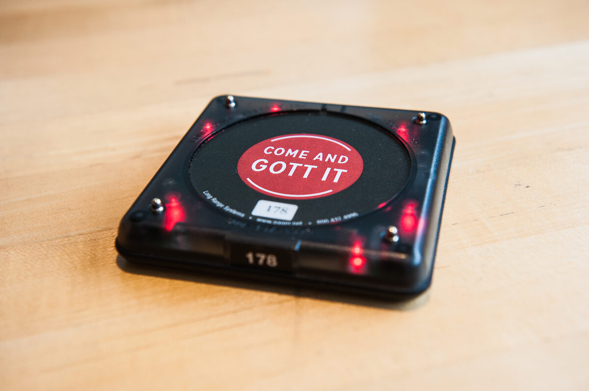 Restaurant pager showing how beeper technology lives on in modern dining