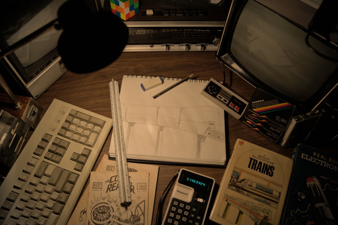 Retro desk with vintage computer and 90s accessories