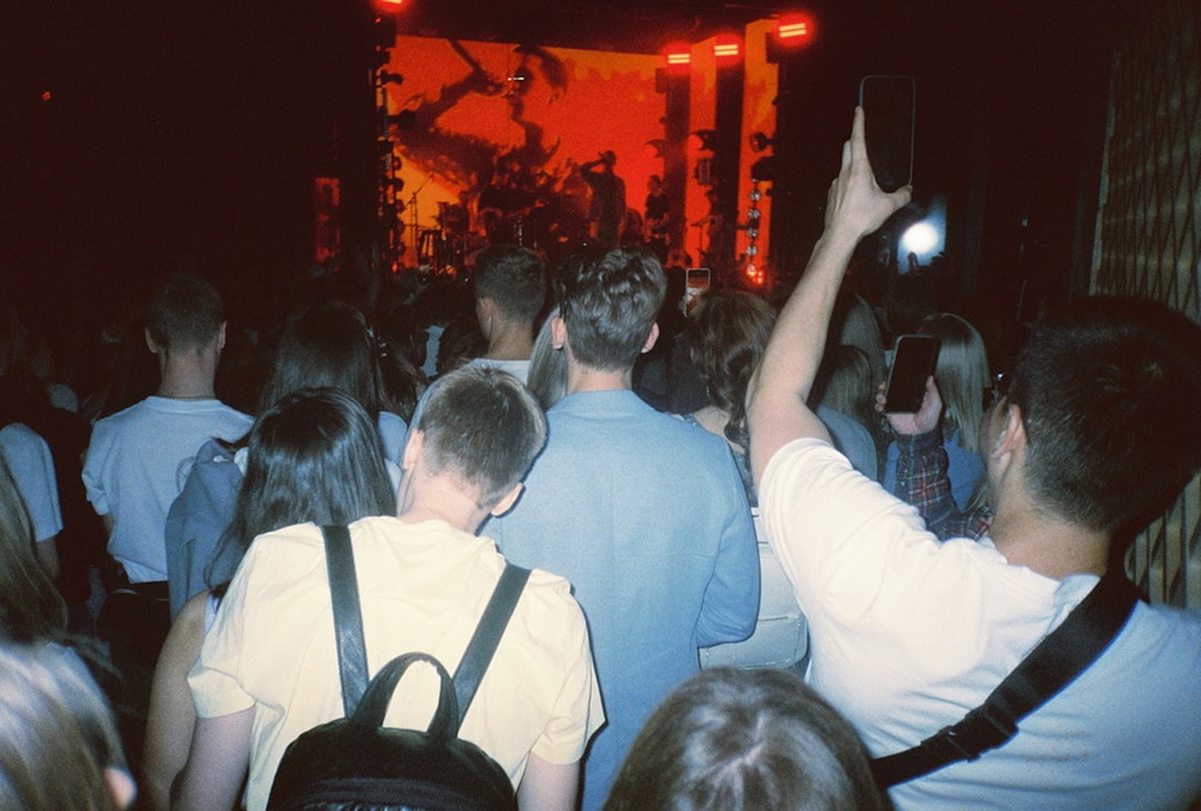 Rock concert crowd where original vintage band tees were sold