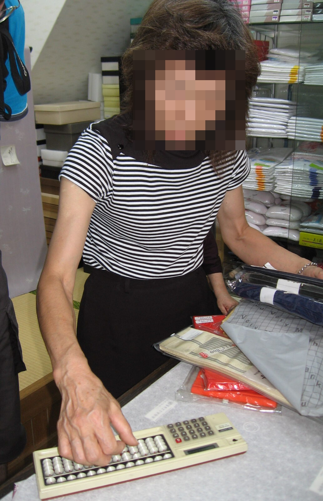 Japanese abacus soroban in use at traditional kimono shop in Japan