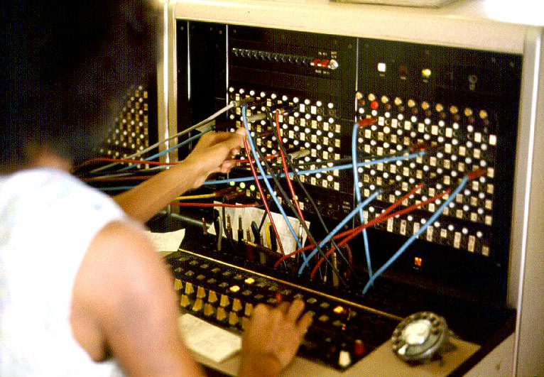 Telephone switchboard operator at work connecting calls