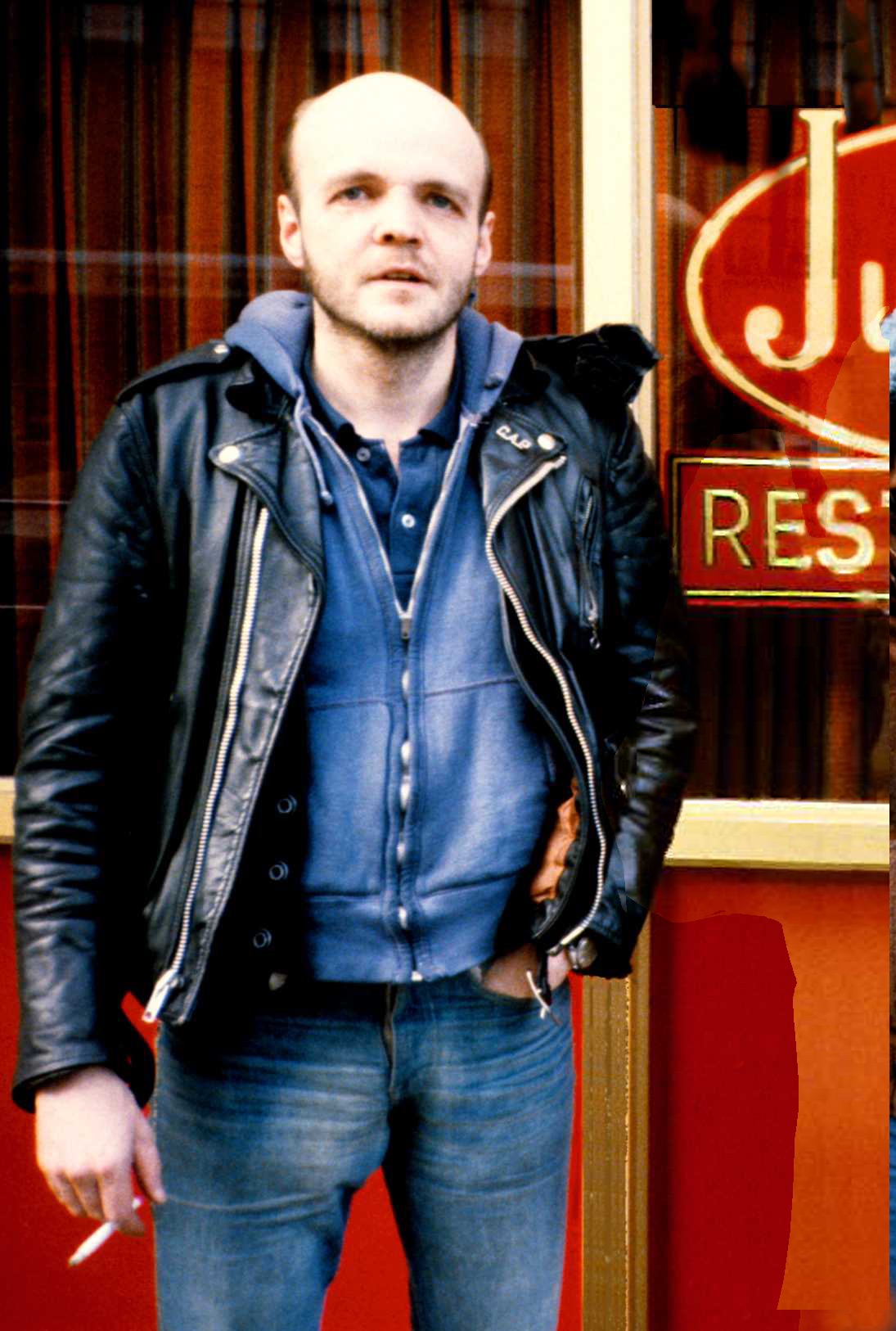Man smoking outside restaurant in New York City in the late 1980s