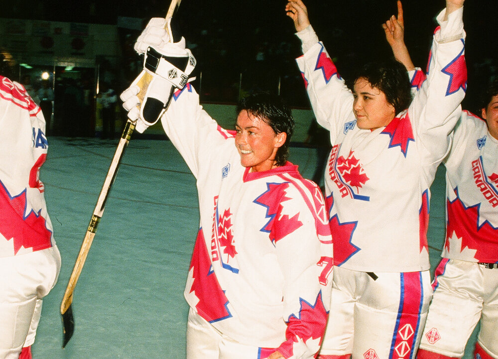 Shirley Cameron and Vicky Sunohara celebrate winning the 1990 IIHF Women World Ice Hockey Championship with Team Canada - Credit: Claus Anderson/HHOF