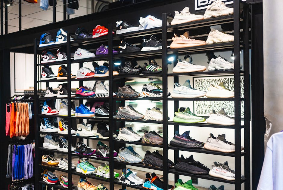 Colorful sneakers from various brands displayed on shelves in a retail store