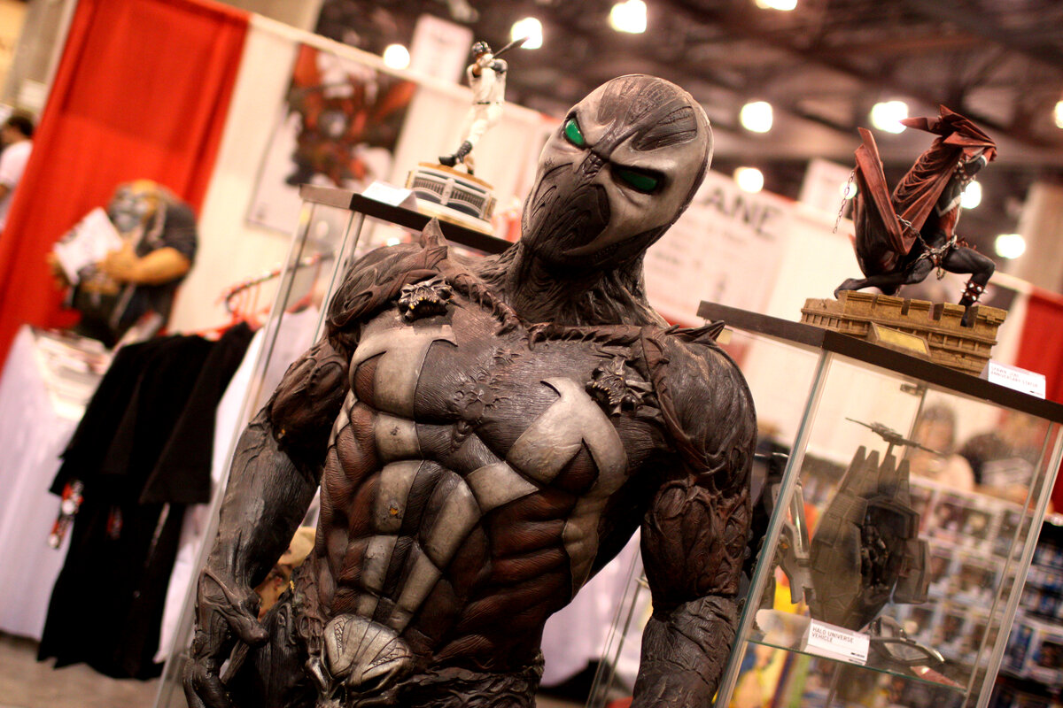 Spawn statue on display at a comic convention showcasing the detailed McFarlane design aesthetic