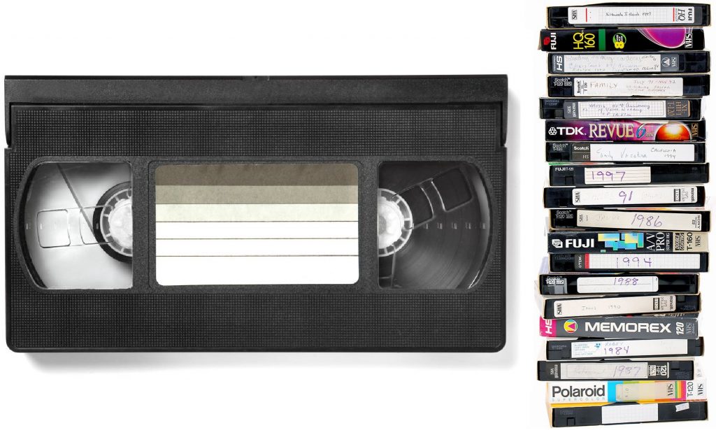 Vintage 1980s VHS VCR player and tapes that won the home video format war
