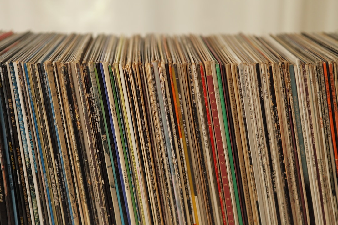 Vinyl records collection alongside vintage band memorabilia
