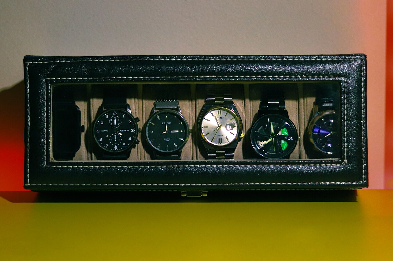 Collection of retro digital wristwatches in display case