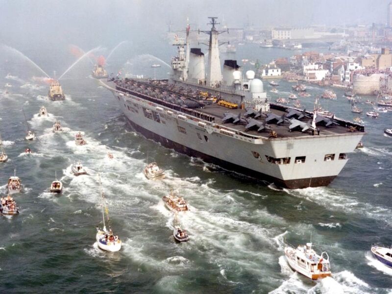 HMS Invincible returns to Portsmouth after Falklands War victory 1982 with Sea Harriers and Sea King helicopters on deck