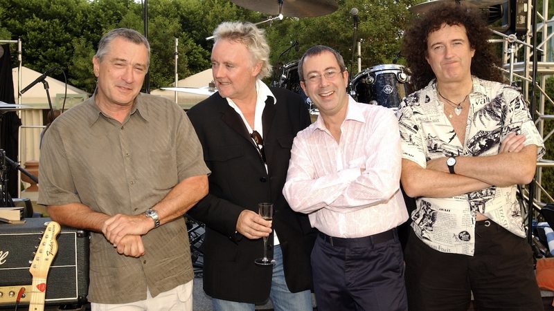 Robert De Niro with surviving Queen members at the Freddie Mercury Tribute Concert 1992