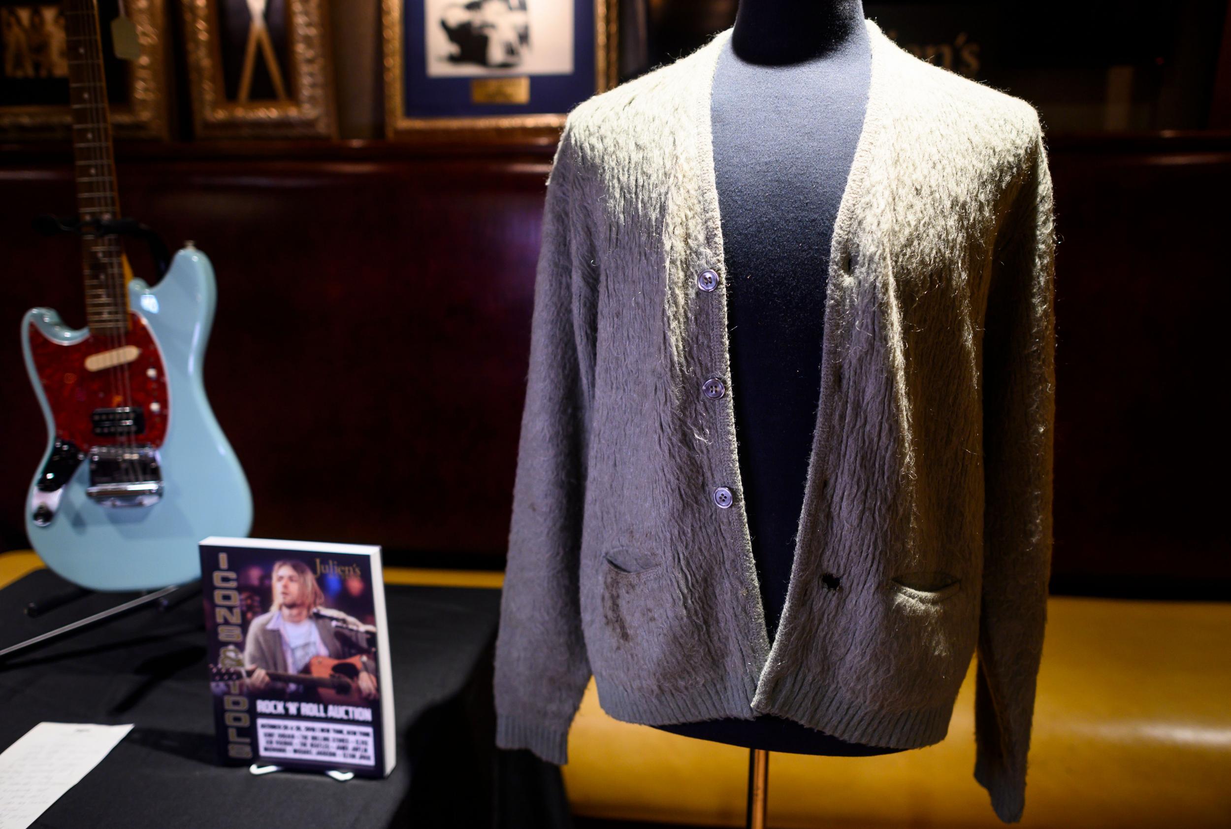 Kurt Cobain’s cardigan from Nirvana’s 1993 MTV Unplugged performance on display at the Hard Rock Cafe in New York City (Getty