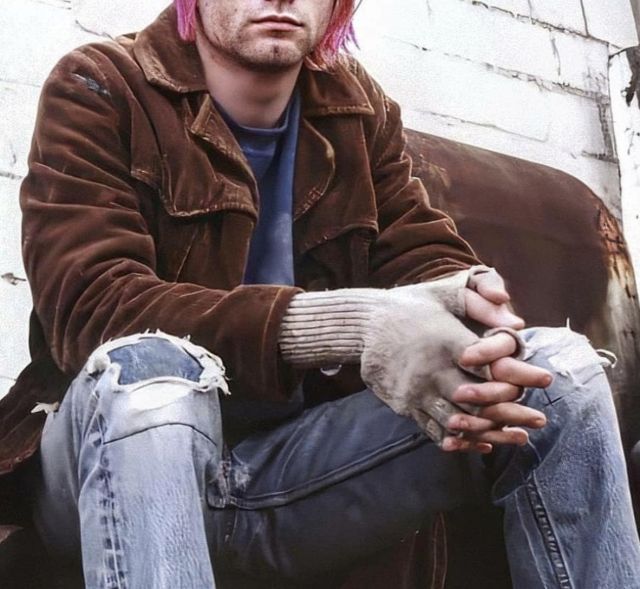 Denim jeans with only the top layer of the knee ripped worn by Kurt Cobain