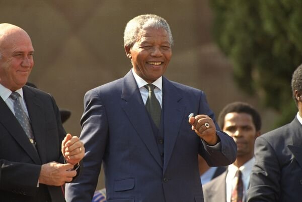 Nelson Mandela and FW de Klerk celebrate together at the inauguration concert