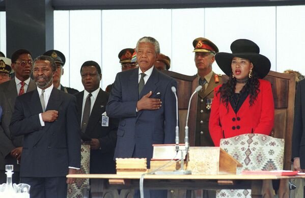 Mandela standing at attention during the new South African national anthem on May 10 1994