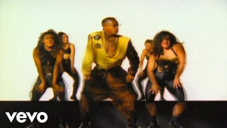 MC Hammer performing U Cant Touch This music video 1990 with backup dancers in iconic yellow outfit