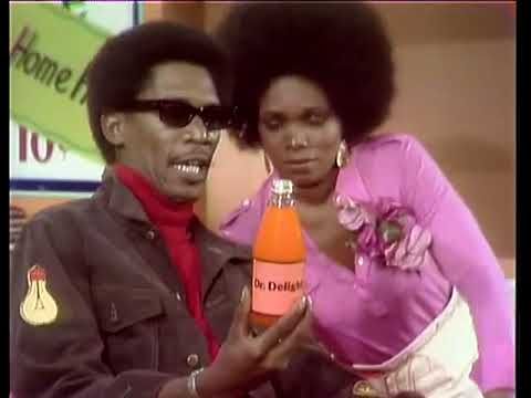 Morgan Freeman as Easy Reader on The Electric Company with cast member holding bottle