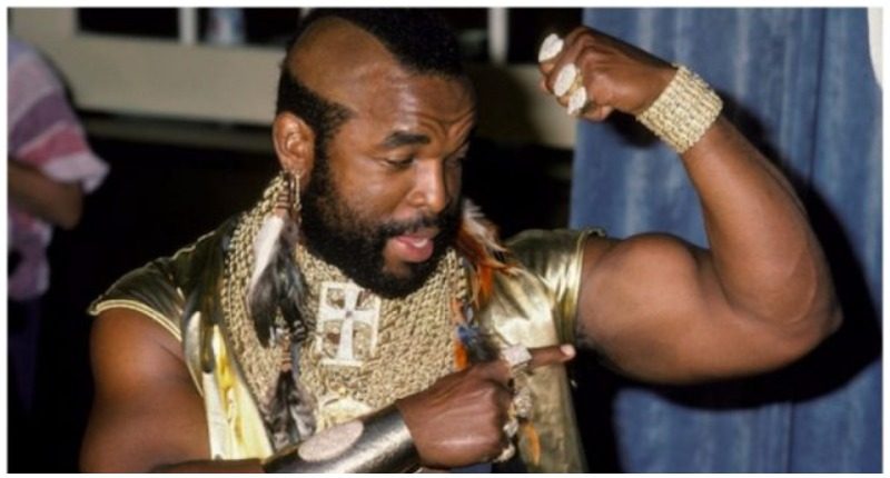 Mr T A-Team BA Baracus flexing biceps gold chains 1980s photo