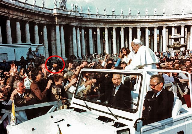 Mehmet Ali Agca circled in crowd as Pope John Paul II passes in popemobile