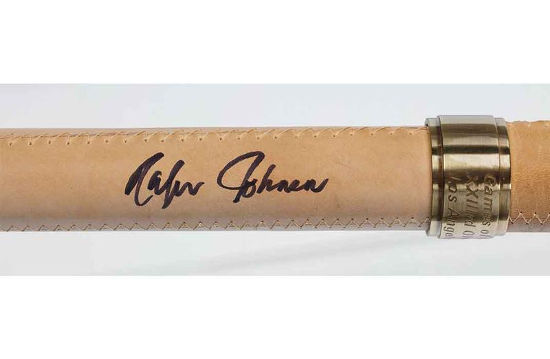 Rafer Johnson signature on the 1984 Olympic torch he carried to light the cauldron