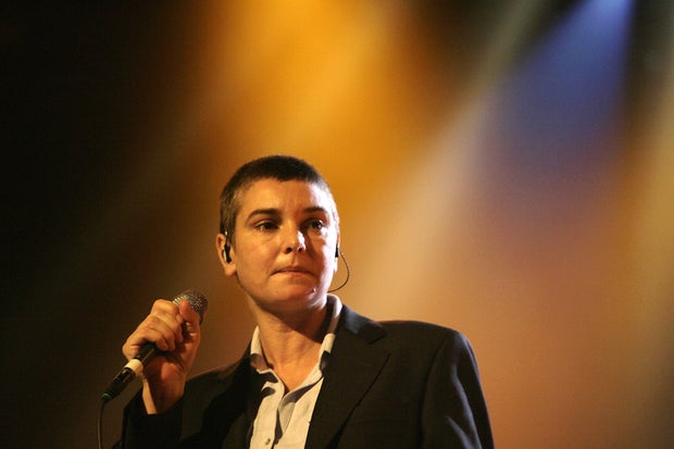Sinead O'Connor performing live with shaved head in 1990