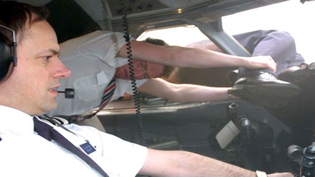 BA Flight 5390 reenactment of flight attendant Nigel Ogden holding Captain Lancaster legs in cockpit