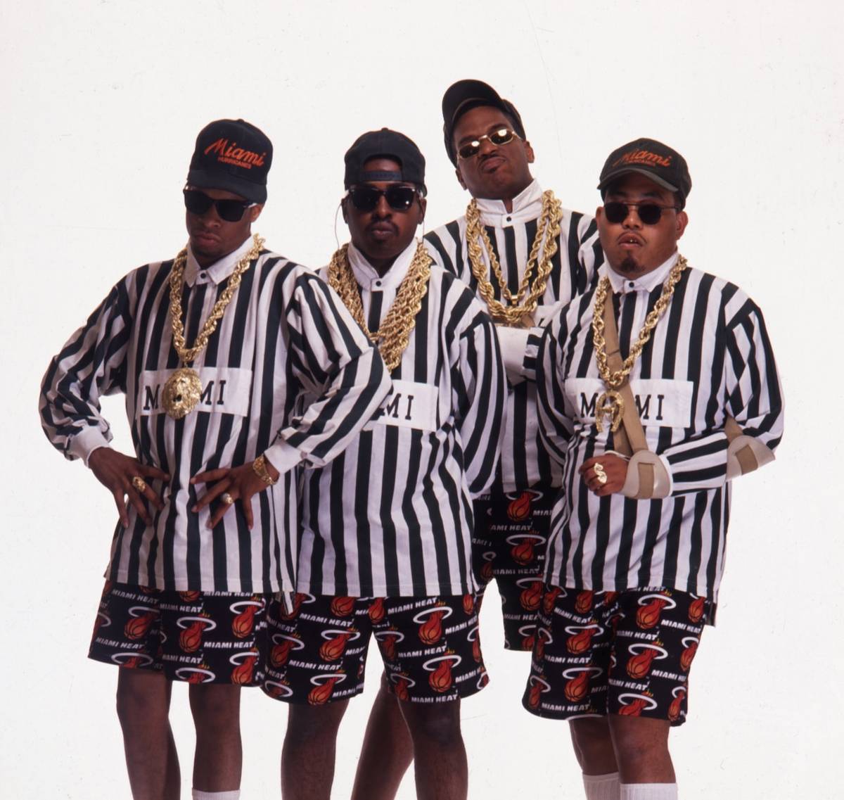2 Live Crew group photo in 1989 wearing Miami gear and gold chains