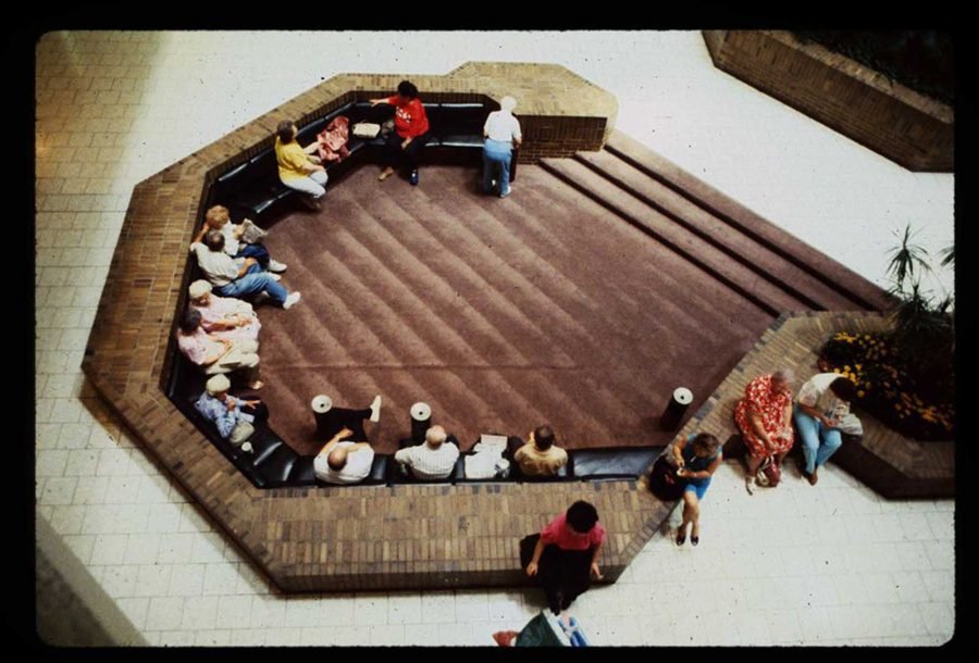 1980s mall architecture overhead view of brick sunken seating pit with shoppers resting